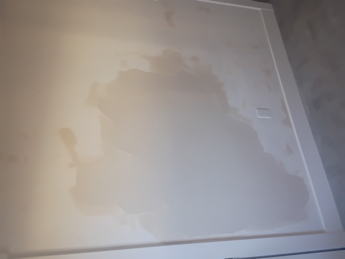 Ceiling and wall before drywall repair
