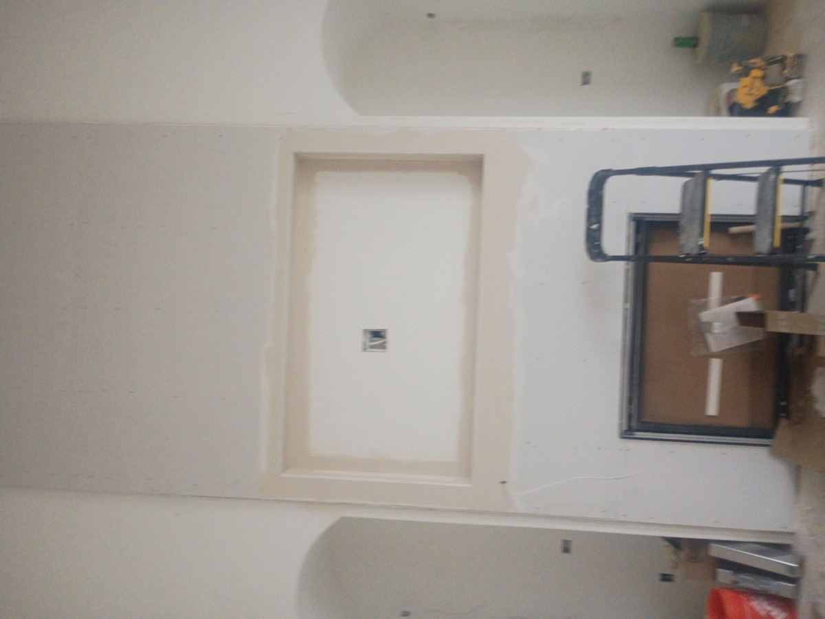 Ceiling and wall drywall repair in progress